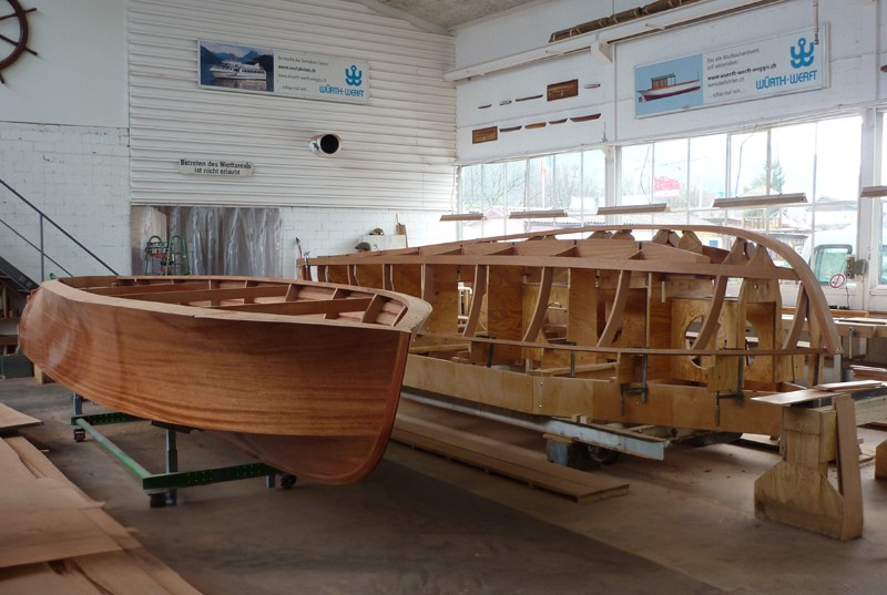 Woodline 800 – Handcrafted Boat Hulls in Production at Würth Werft AG Handcrafted wooden hulls of the Woodline 800 luxury boats under construction at Würth Werft AG, showcasing Swiss boatbuilding craftsmanship.